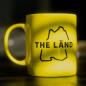 Preview: Gelbe Tasse mit THE LÄND Logo