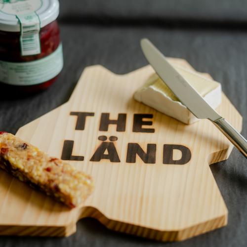 Wooden board in shape of THE LÄND