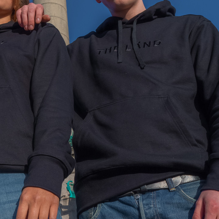 The black THE LÄND Hoodie | Now in THE LÄND FÄNSHOP